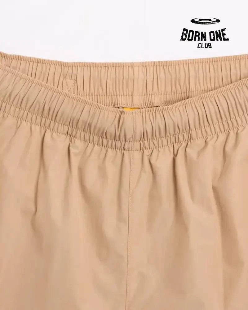 Conjunto Nike x NOCTA Woven Track Bege Areia/Marrom Claro Jaqueta e Calça