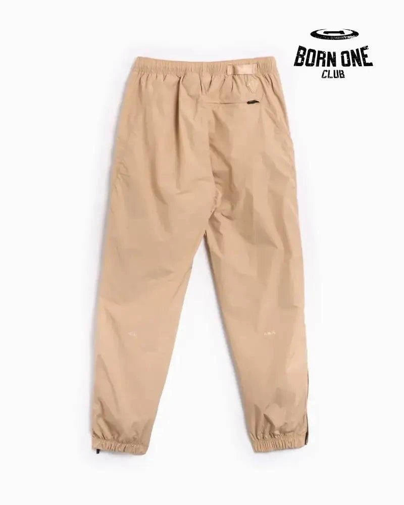 Conjunto Nike x NOCTA Woven Track Bege Areia/Marrom Claro Jaqueta e Calça