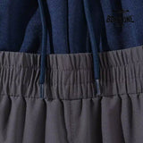 Balenciaga Cut-Up Tracksuit Pants in Grey Calça