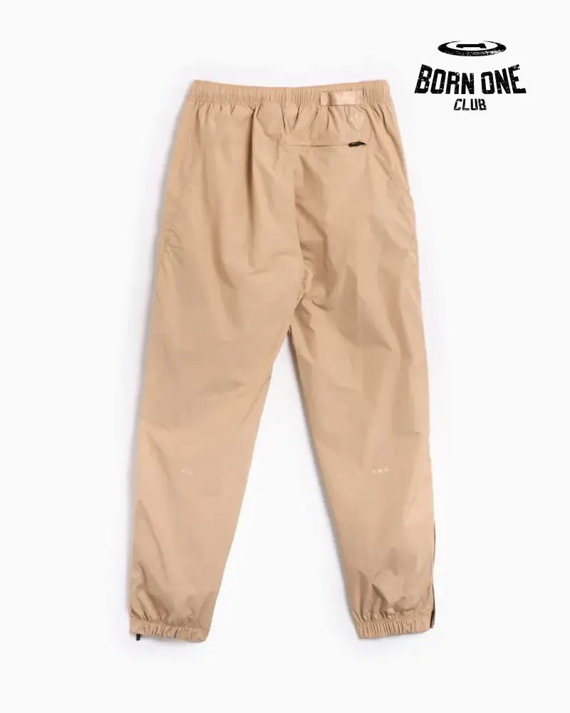 Conjunto Nike x NOCTA Woven Track Bege Areia/Marrom Claro Jaqueta e Calça