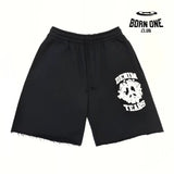 DENIM TEARS UNIVERSITY SHORTS
