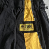Shorts Corteiz Preto Amarelo